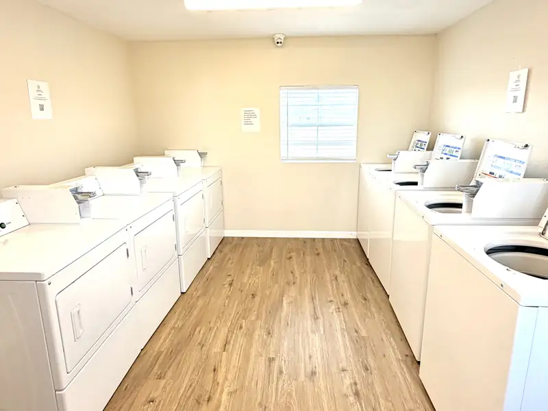 Washers and dryers inside the on-site laundry room